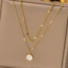 Layered Gold Necklace with Round Pearl-Like Pendant – Elegant Multi-Chain Jewelry for Women Layered Gold Necklace with Round Pearl-Like Pendant – Elegant Multi-Chain Jewelry for Women